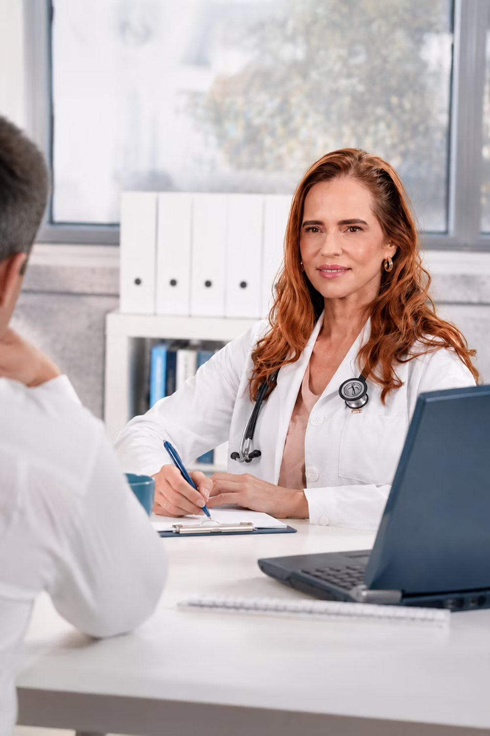Internal medicine specialist consulting with patient